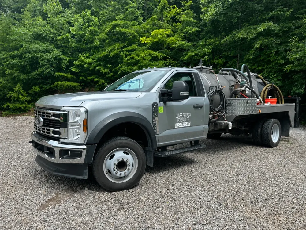 Oliver Springs Portable Toilets service truck for on-time delivery and pickup